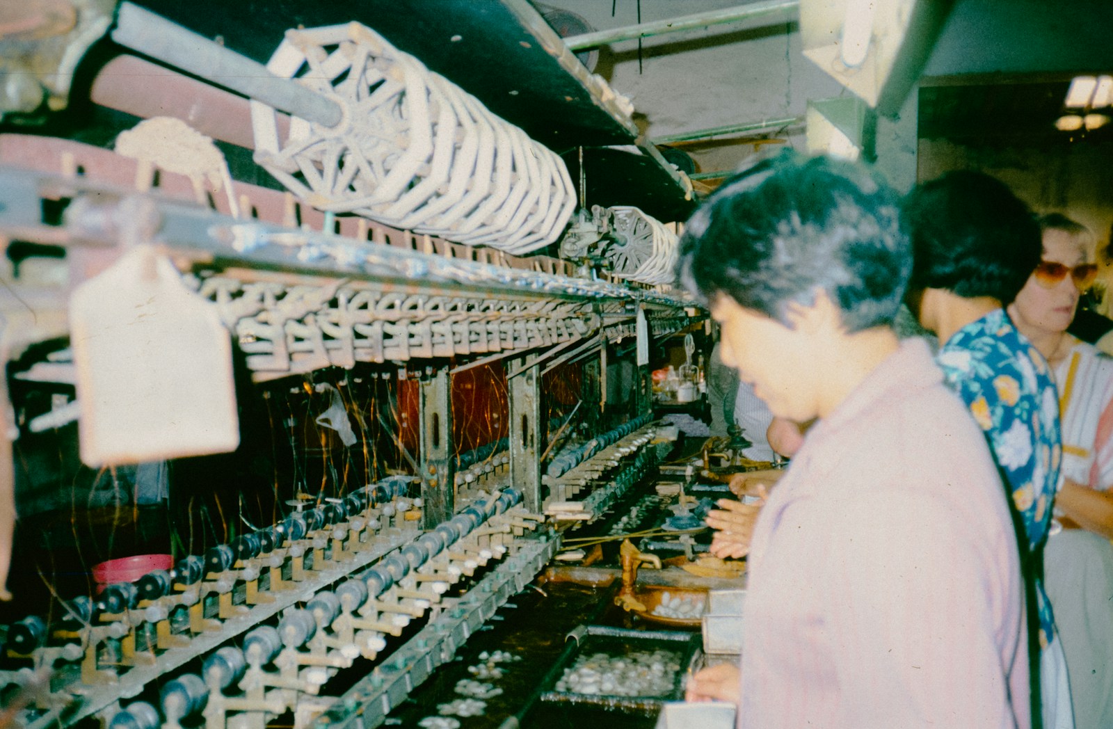 A group of people standing in front of a machine